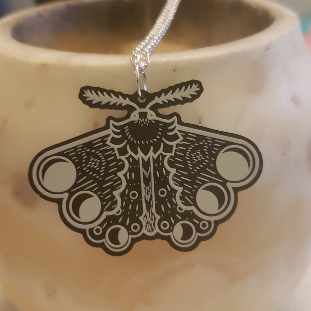 Moth pendant with 20" chain.